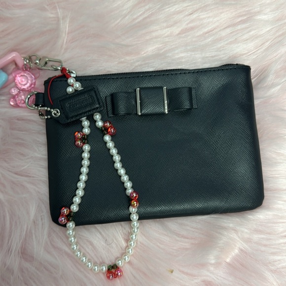 Elegant Black Women's Coach wristlet with bow coquette - Picture 3 of 6